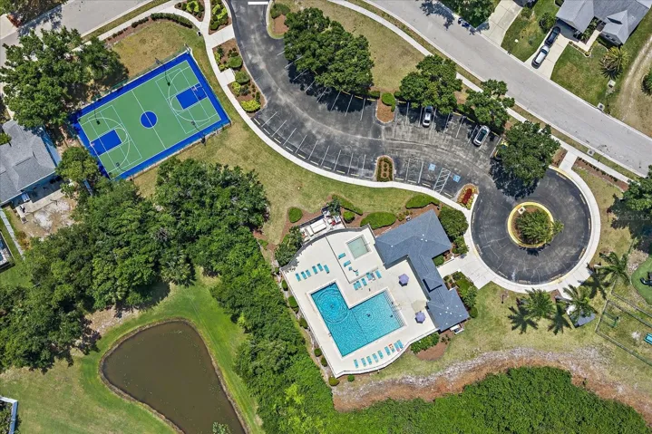 Aerial of clubhouse, pool, kiddie pool, basketball/tennis courts