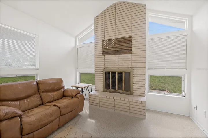 Family Room with Wood-Burning Brick Fireplace