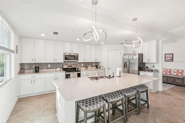Large quartz island with room for 4 bar stools.