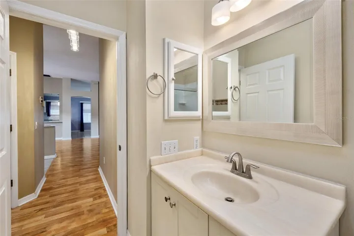 Looking out of BATHROOM #2 and down the HALLWAY to main living area.