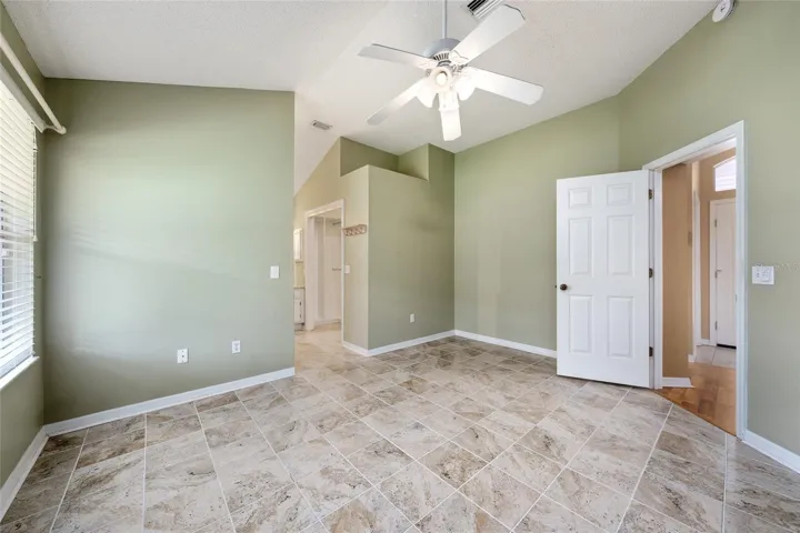 PRIMARY BEDROOM - Note CUSTOM CLOSET ORGANIZATION on R side of hallway to ENSUITE BATHROOM