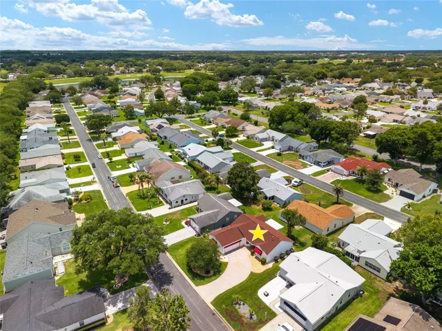 AERIAL - looking South over Cortez Avenue, highlighting the home’s setting on a dead-end street and its close proximity to Chula Vista Executive Golf Course, visible across the distance.