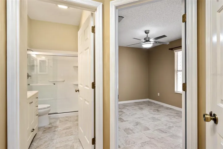 HALLWAY leading to BATHROOM #2 (L) and BEDROOM #2 (back R). Note: LINEN CLOSET on far R.
