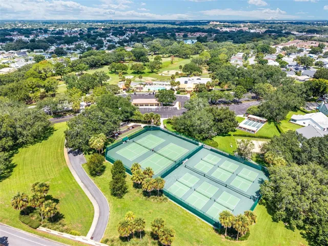 AERIAL looking Northwest - showcasing 2 tennis courts, and 6 pickleball courts, the sand volleyball court, and shuffleboard courts of the Chula Vista Recreation Center.
