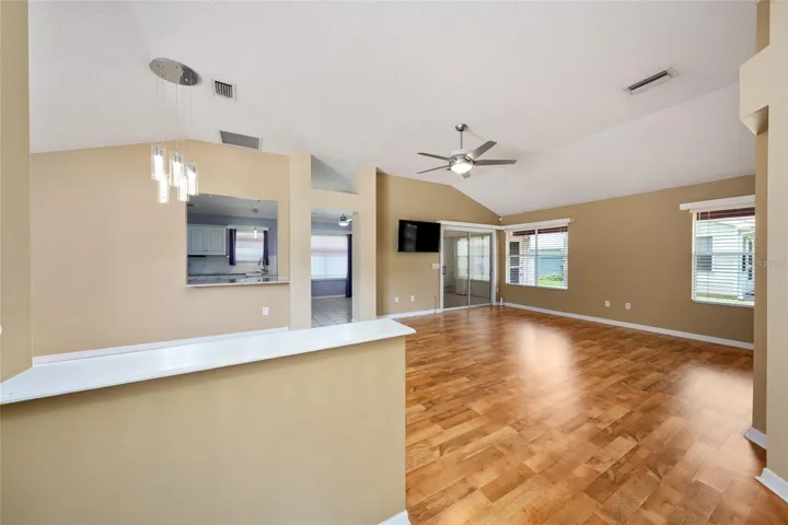 View from FOYER - VAULTED CEILING over OPEN CONCEPT main living area