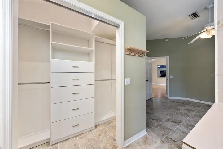 PRIMARY BEDROOM - Note the CUSTOM CLOSET ORGANIZATION SYSTEM