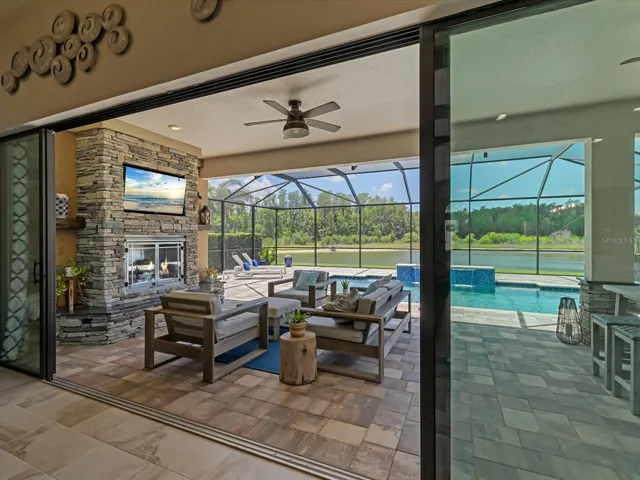 16ft sliding glass doors opening to the outdoor oasis