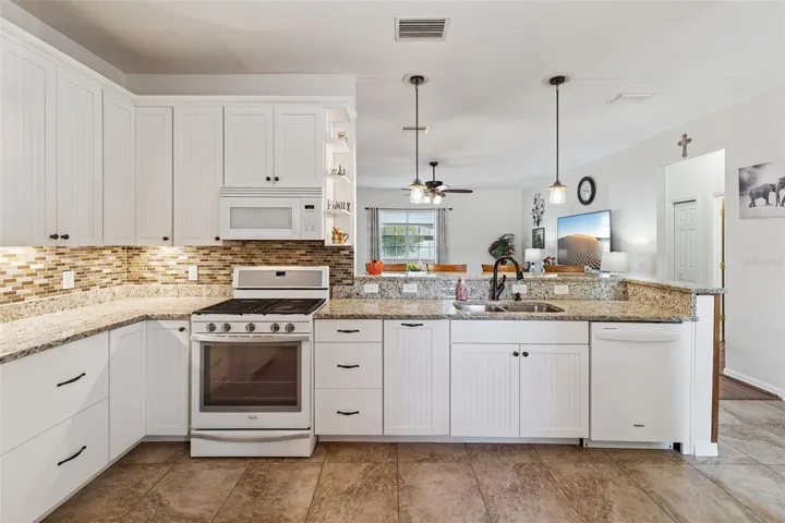 Custom Cabinetry with soft close hinges, undermount lighting and oil-rubbed bronze hardware