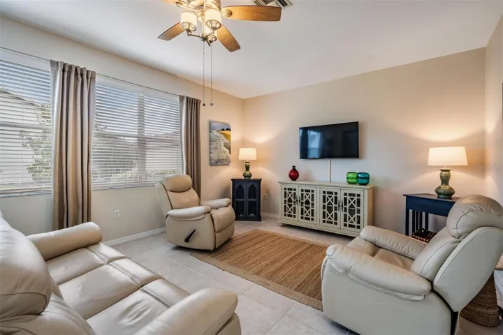 Den with tile flooring