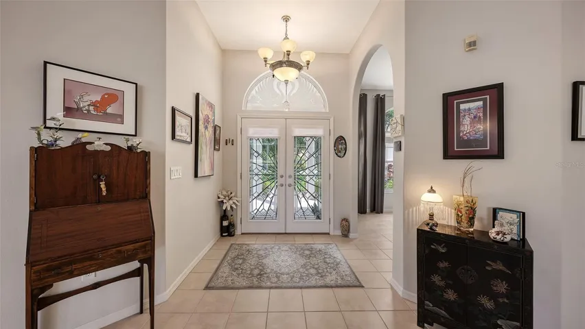 The Formal Entry leads to a large Living Room, Dining Room, & Den