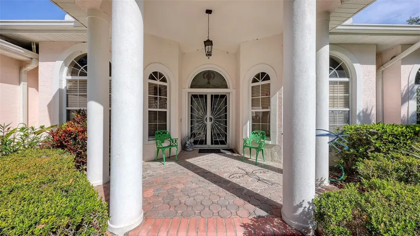A Beautiful, Columned, Covered, Double Door Entry Greet you