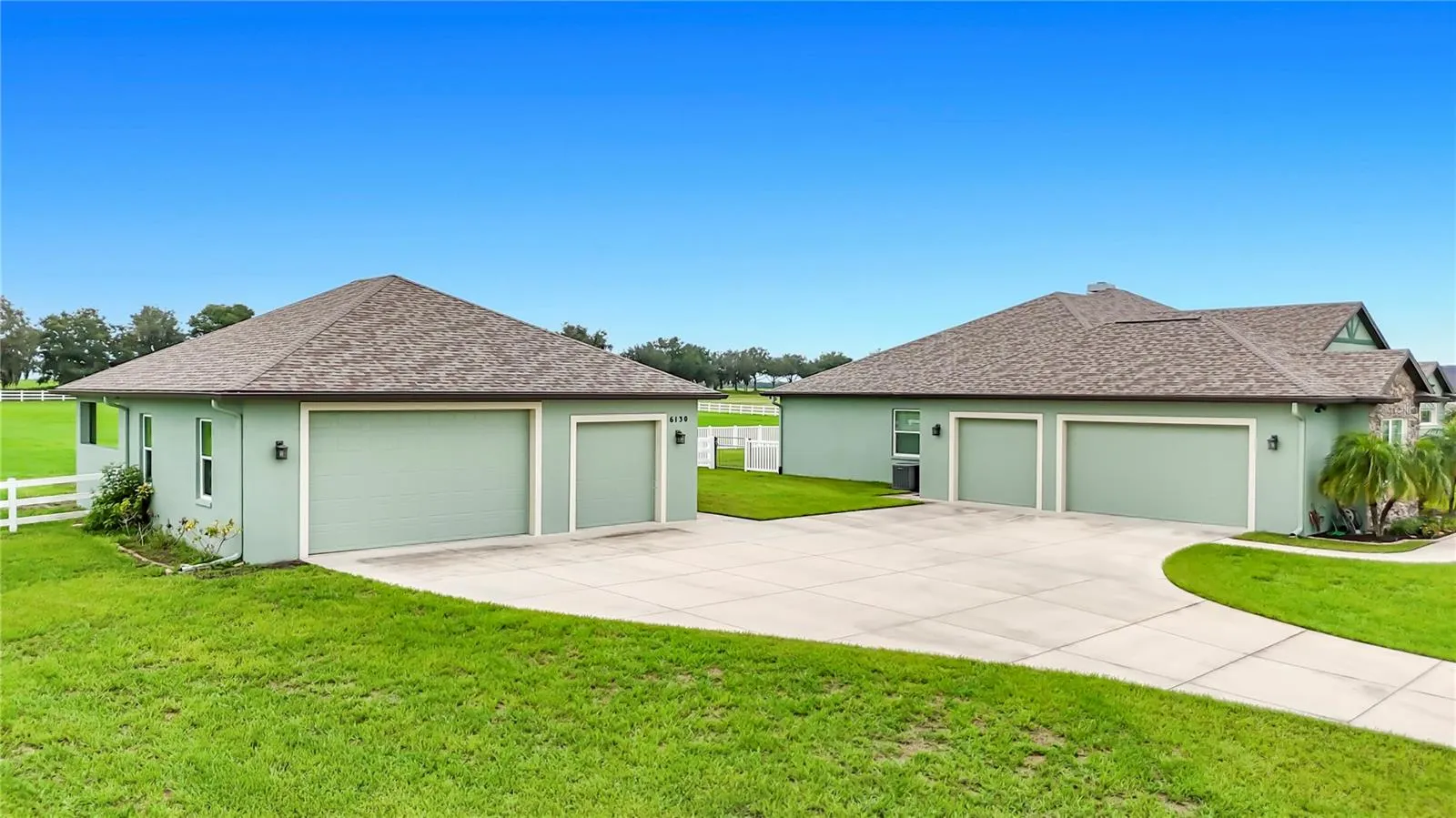 Detached garage adds 2 extra car stalls and an air conditioned storage/tack/exercise room