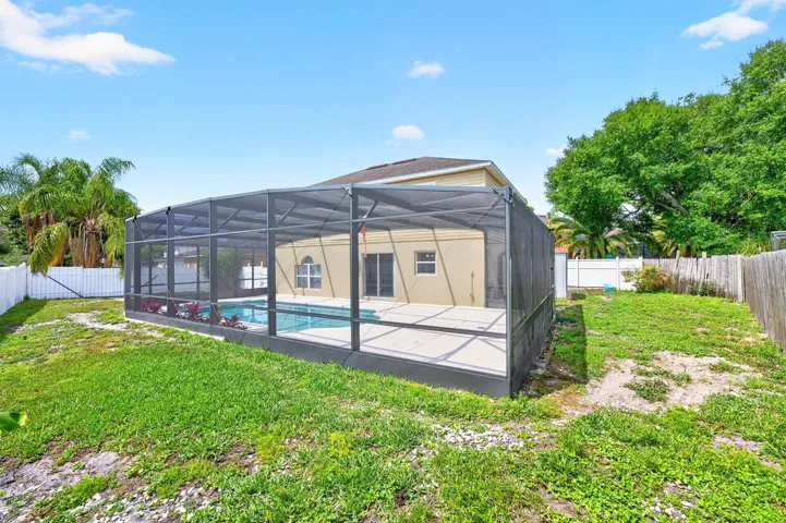 Screened pool, privacy fenced yard.