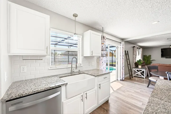 Stainless steel appliances, farmhouse sink.