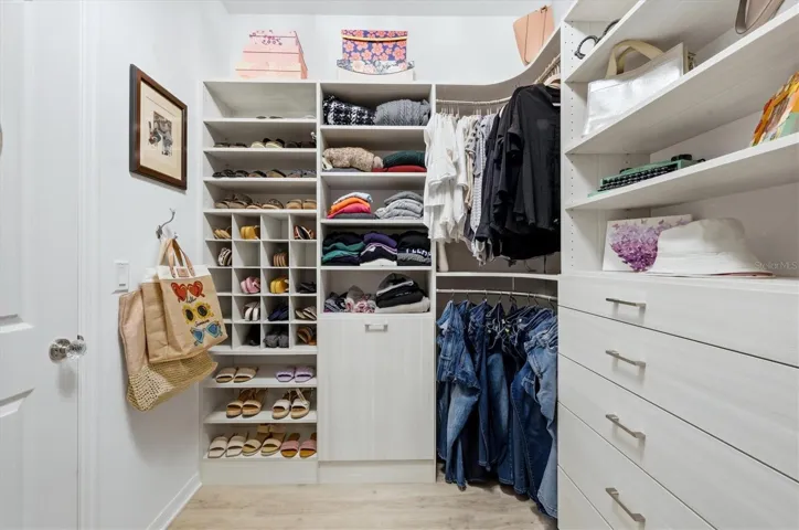 Primary closet with amazing organizer