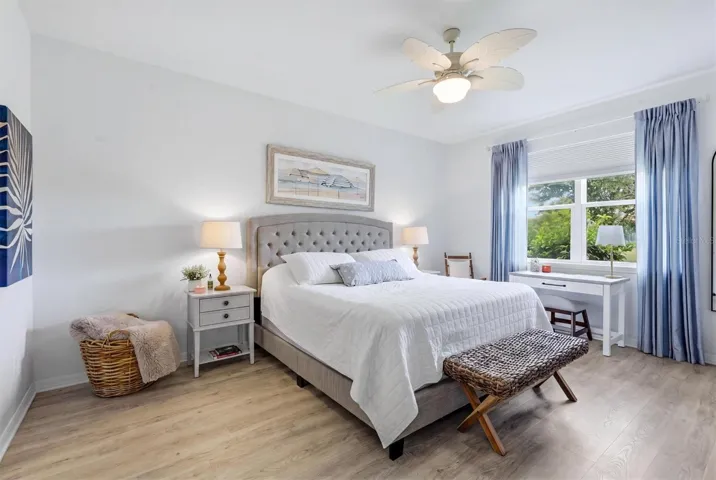 Primary bedroom with peaceful pond view