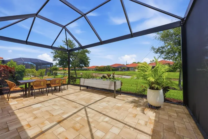 Spacious lanai with water view behind it