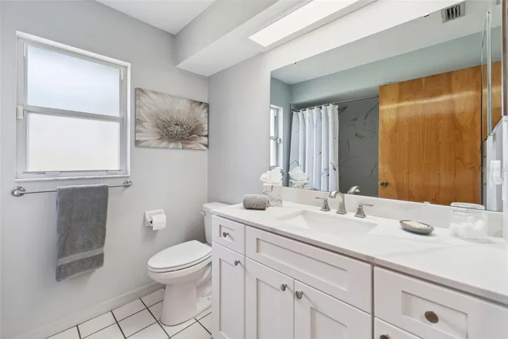 Remodeled Guest Bathroom with Comfort Heigh Vanity and Toilet