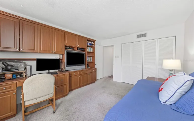 Main level bedroom with built-ins