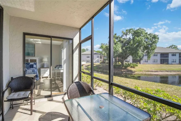 Walk out from Primary Bedroom onto screened rear patio.