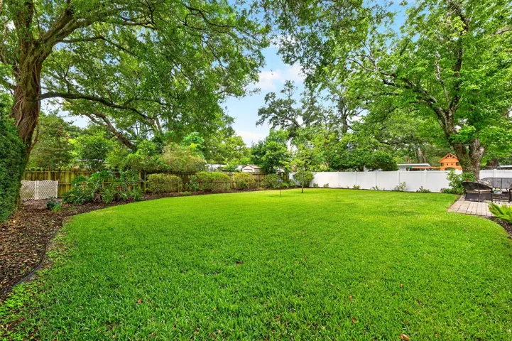 The SPACIOUS VINYL FENCED YARD offers privacy and endless possibilities.