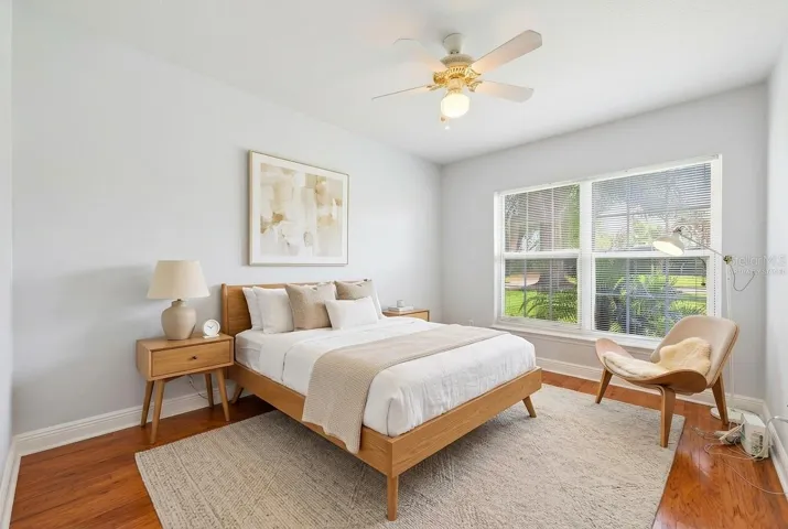 Two additional bedrooms provide flexibility for family, guests, or a home office—one featuring distinctive SLATE FLOORING (2018) and the other WARM WOOD FLOORING—both conveniently located near the second full bath. Bedroom 3 Virtually Staged