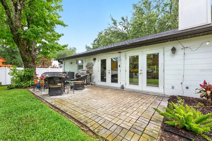 Step outside and enjoy the home’s beautifully landscaped BACKYARD RETREAT with NEW SOD added in 2023.