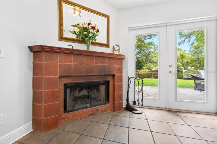 The beautiful MASONRY WOOD-BURNING FIREPLACE creates a cozy focal point for the home.