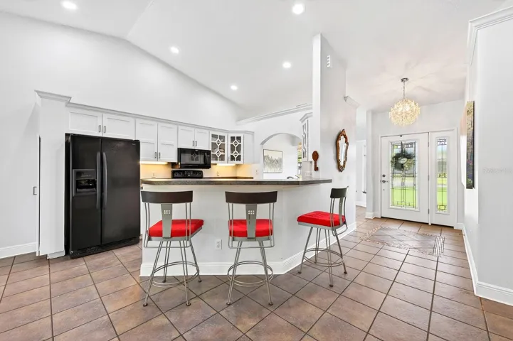 A BOSCH DISHWASHER (2021), breakfast bar seating, and a walk-in pantry offer both style and functionality to the Kitchen.