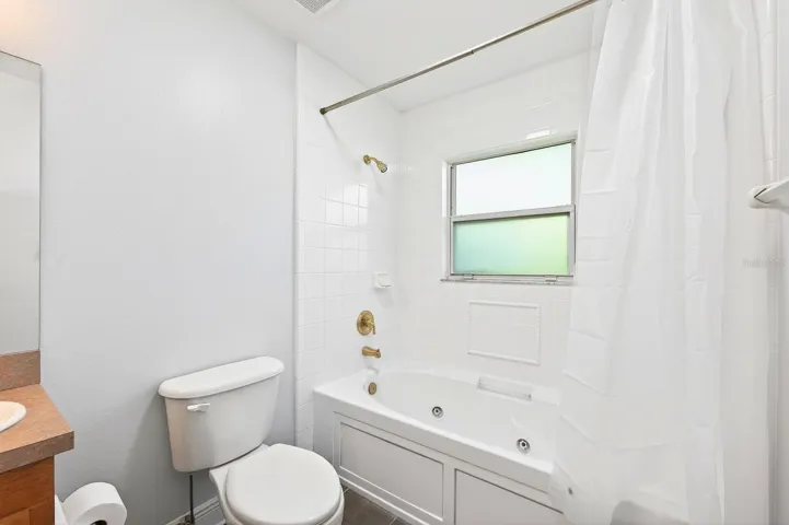 The Primary EN SUITE BATH is complete with dual sinks and a NEWLY UPDATED JETTED TUB WITH SHOWER (2026).