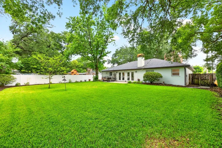 The SPACIOUS VINYL FENCED YARD offers privacy and endless possibilities.
