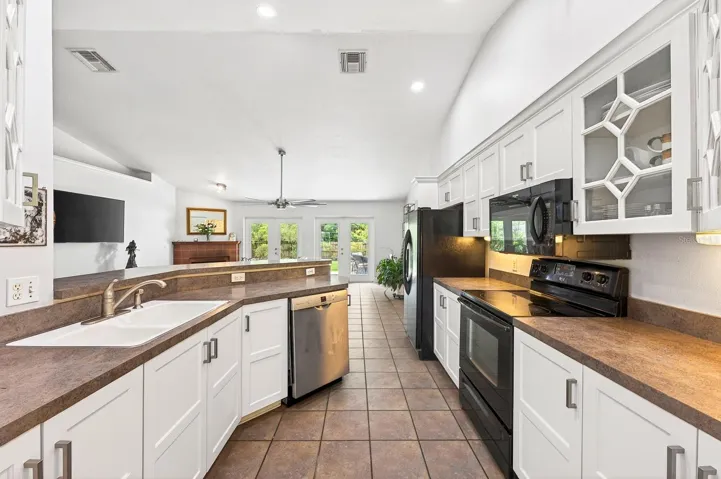 A BOSCH DISHWASHER (2021), breakfast bar seating, and a walk-in pantry offer both style and functionality to the Kitchen.
