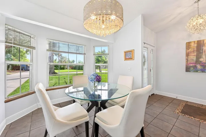 The formal Dining Room features a LOVELY BAY WINDOW overlooking the front yard, creating a bright and elegant setting for gatherings and special occasions.