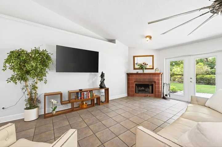 The beautiful MASONRY WOOD-BURNING FIREPLACE creates a cozy focal point for the home.