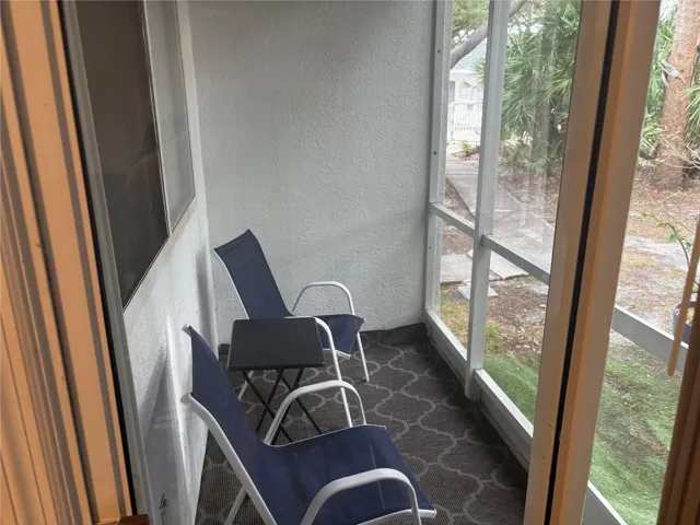 Screened patio off living room. Steps from pool.