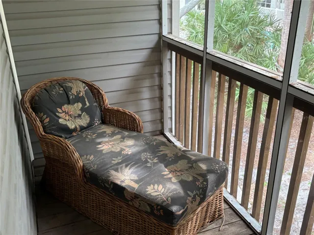 Balcony off master bedroom with view of pool.