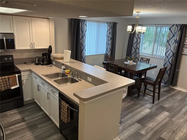Kitchen overlooking dining area.