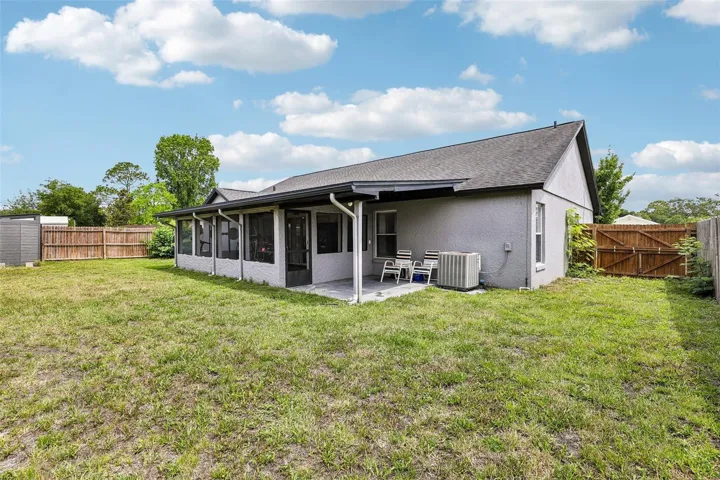 Screened lanai, extended covered patio and a fully fenced yard.