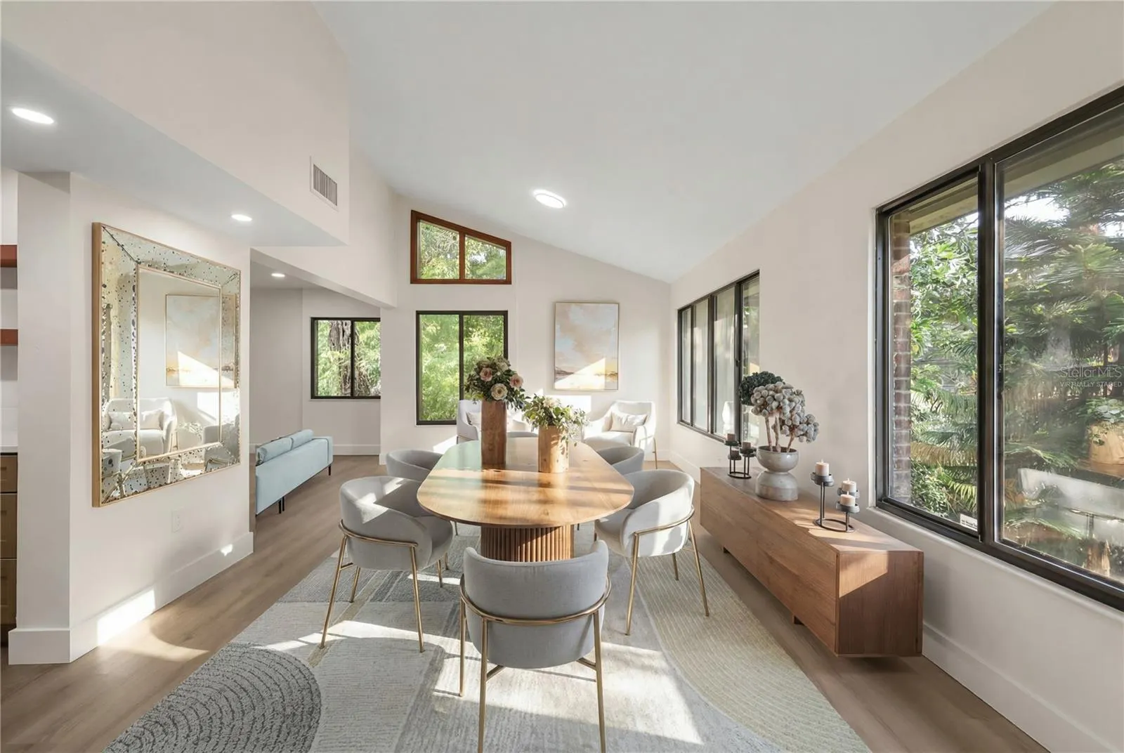 virtually staged dining room and sitting area