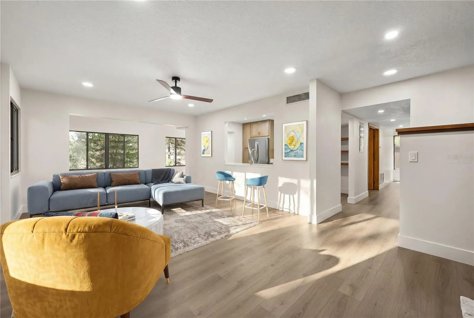 virtually staged living room looking towards dining area