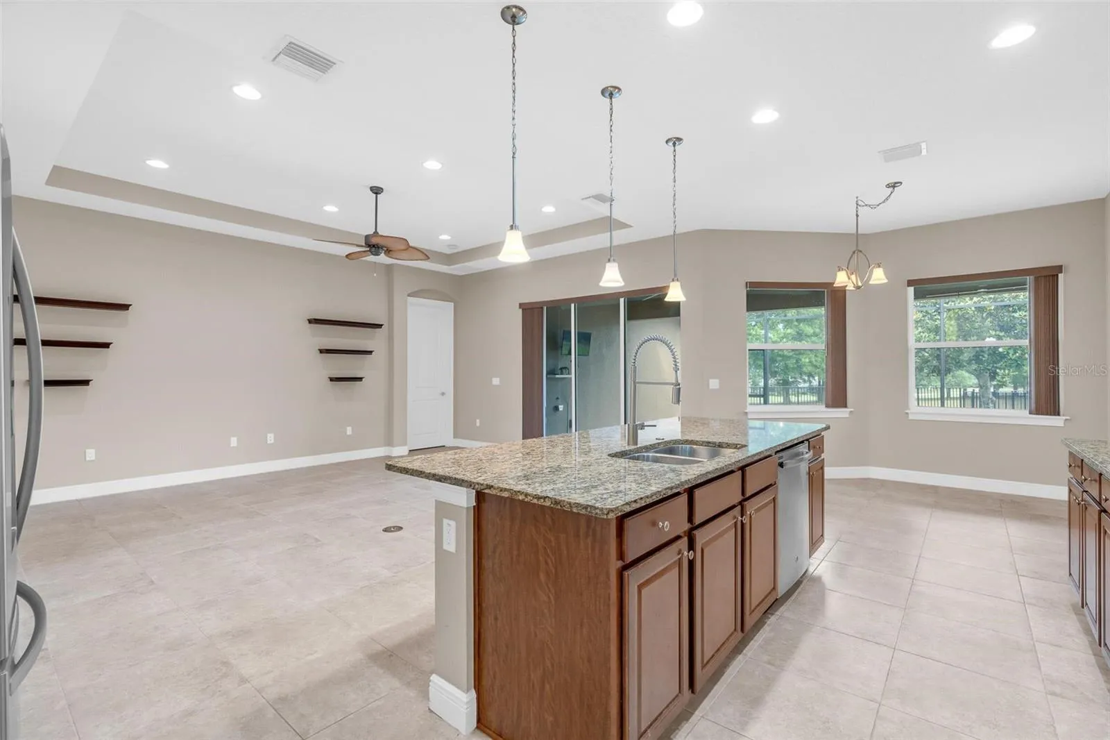 BUTLERS PANTRY WITH VIEWS OF LIVING / KITCHEN TO BACKYARD