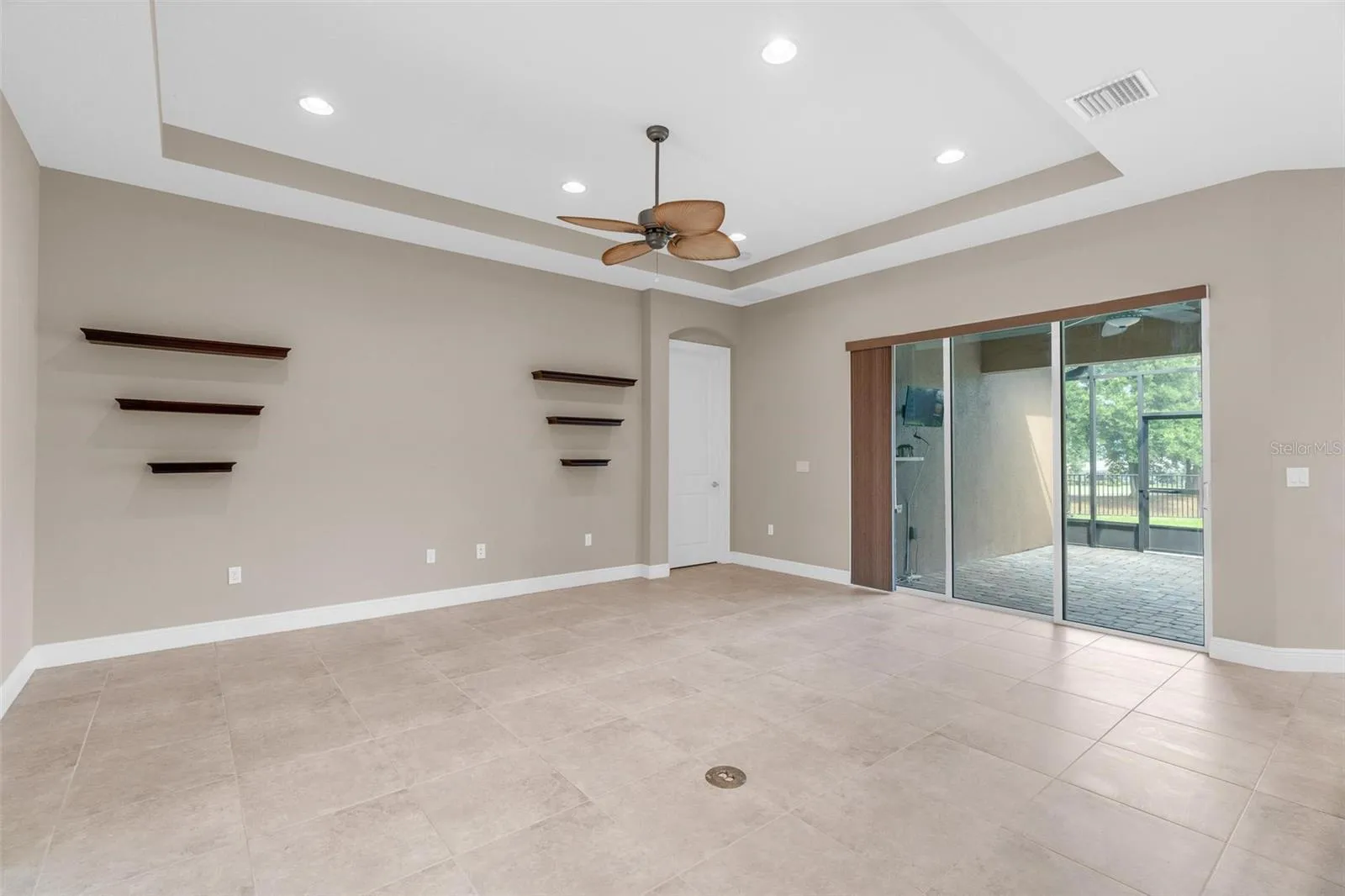 MAIN LIVING WITH SLIDERS TO SCREENED PATIO