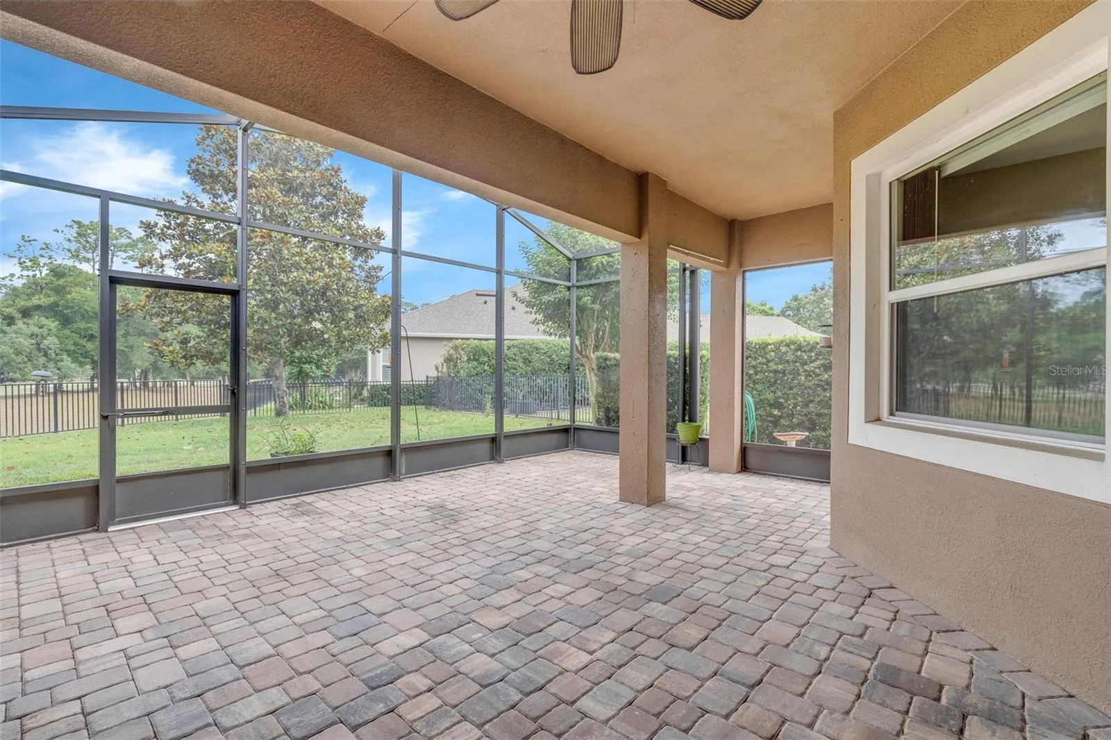 SCREENED PATIO OVERLOOKING GOLF COURSE