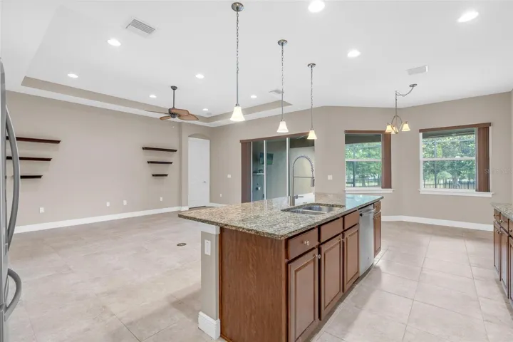 BUTLERS PANTRY WITH VIEWS OF LIVING / KITCHEN TO BACKYARD