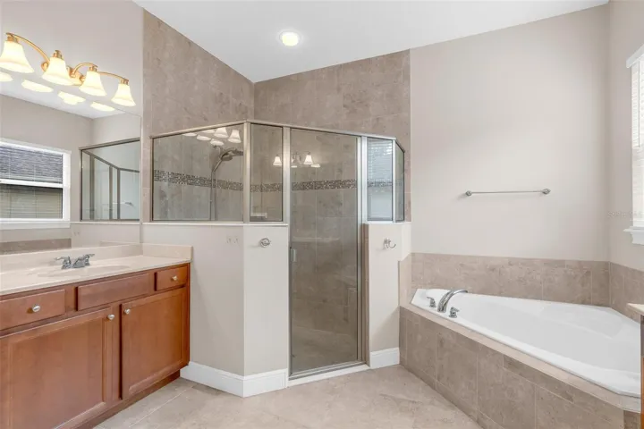 PRIMARY BATHROOM. DUAL SINKS, SOAKING TUB + WALK IN SHOWER