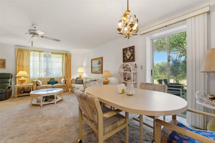 Living area and dinette open to side lanai
