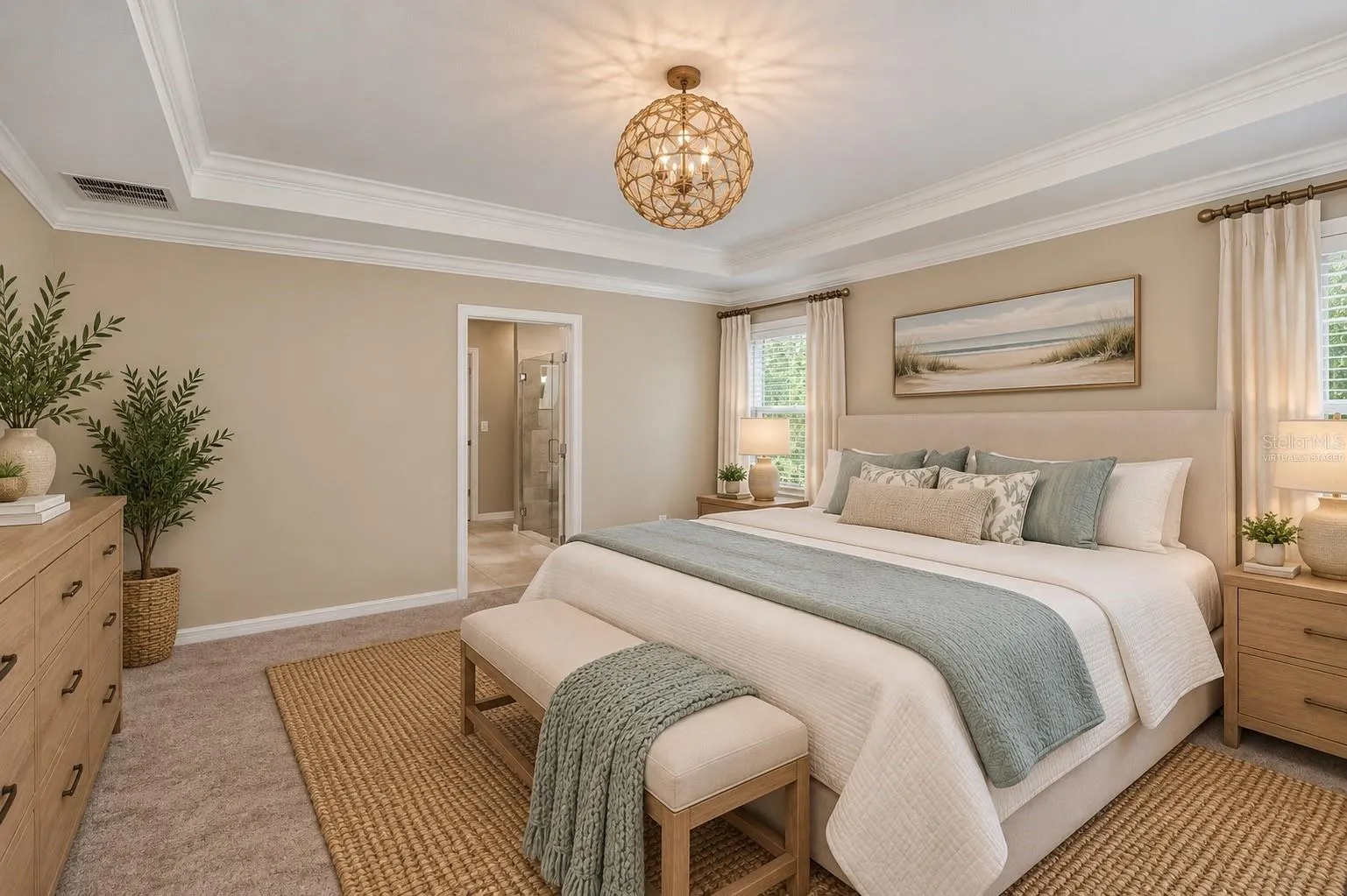 Virtually Staged Luxurious Primary Suite with Tray Ceiling, Crown Molding &amp; Designer Lighting.