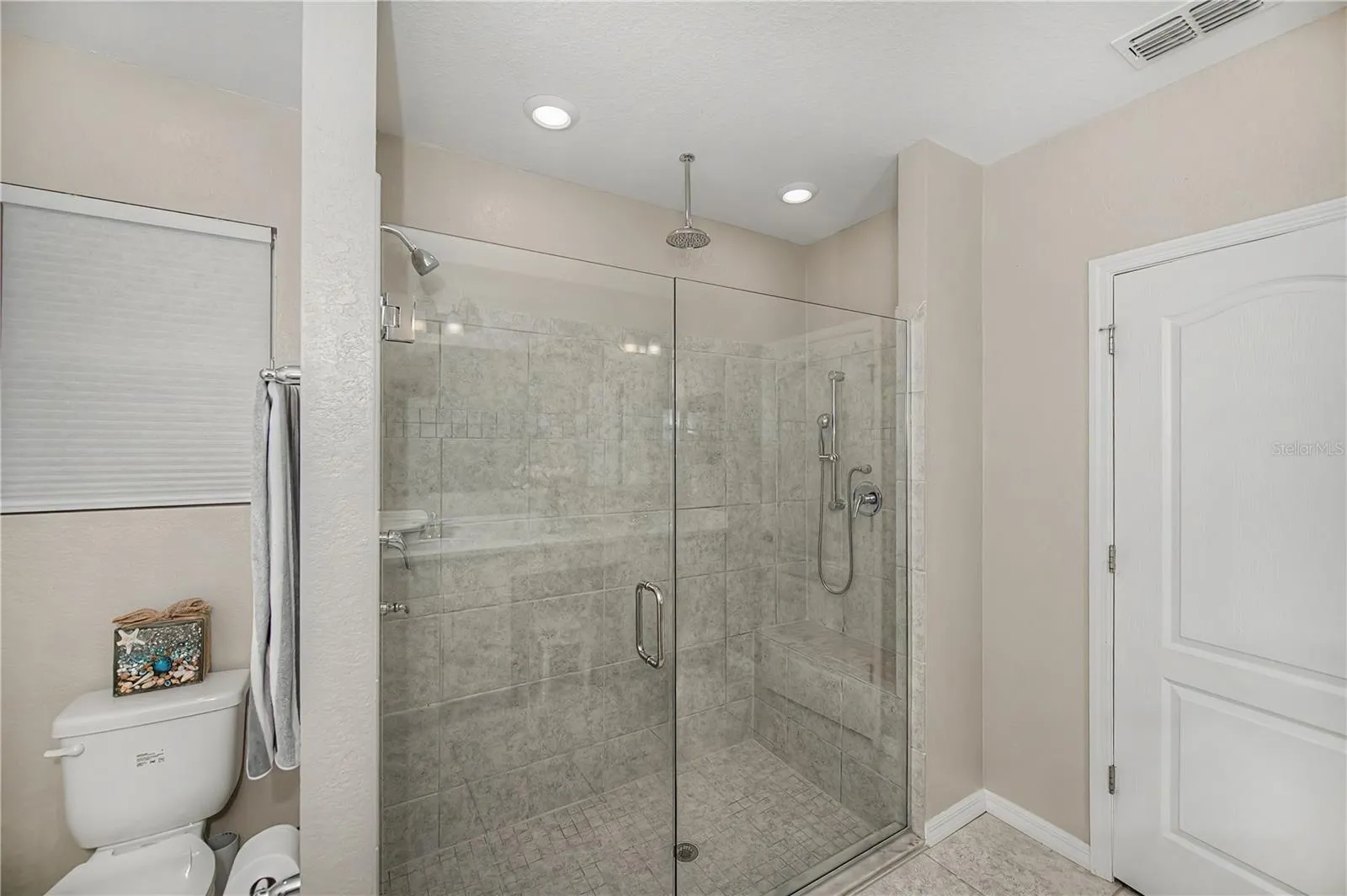 Walk-In Shower with Seamless Glass Enclosure.