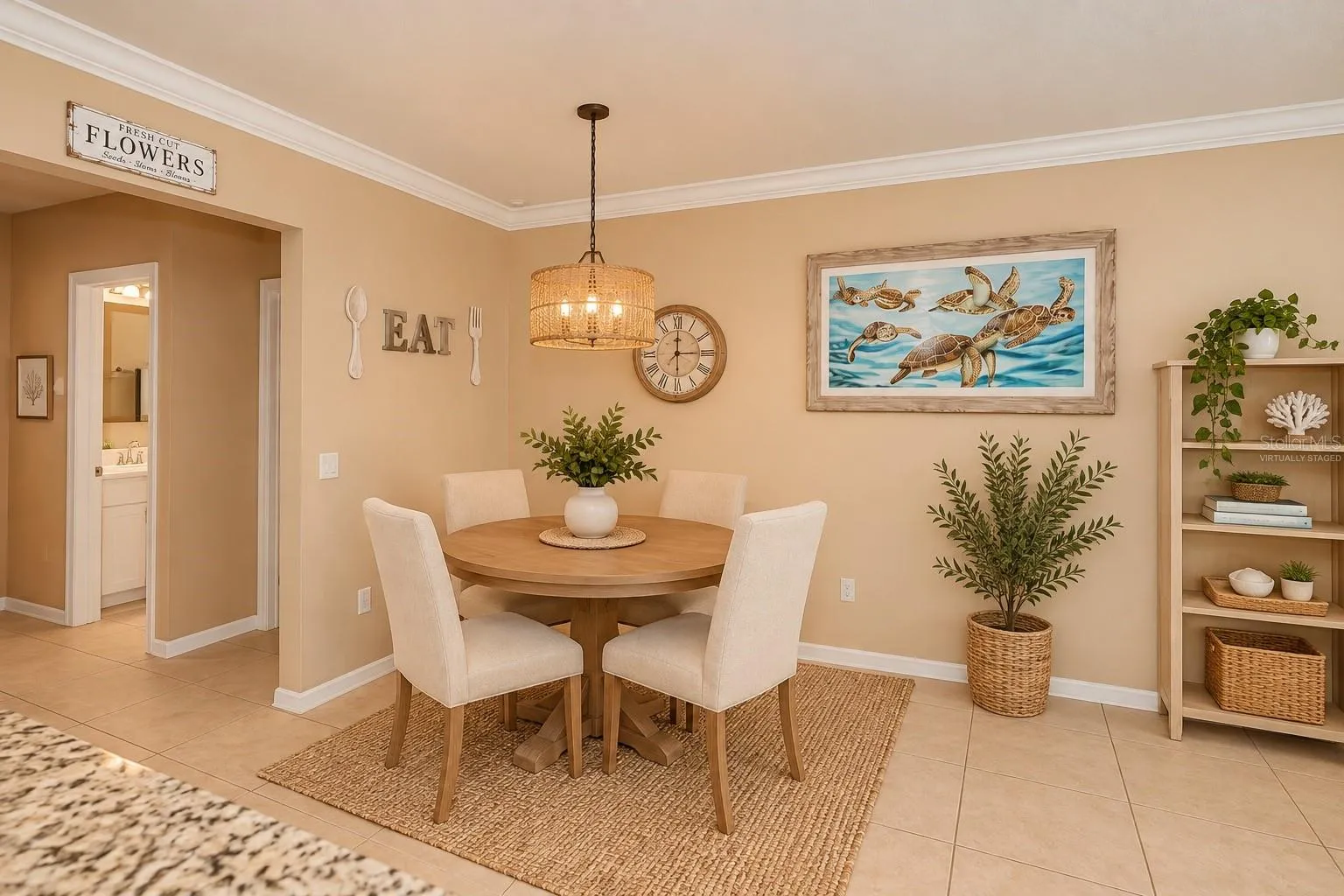 Virtually Staged Dining Area Adjacent to Kitchen and Living Room.