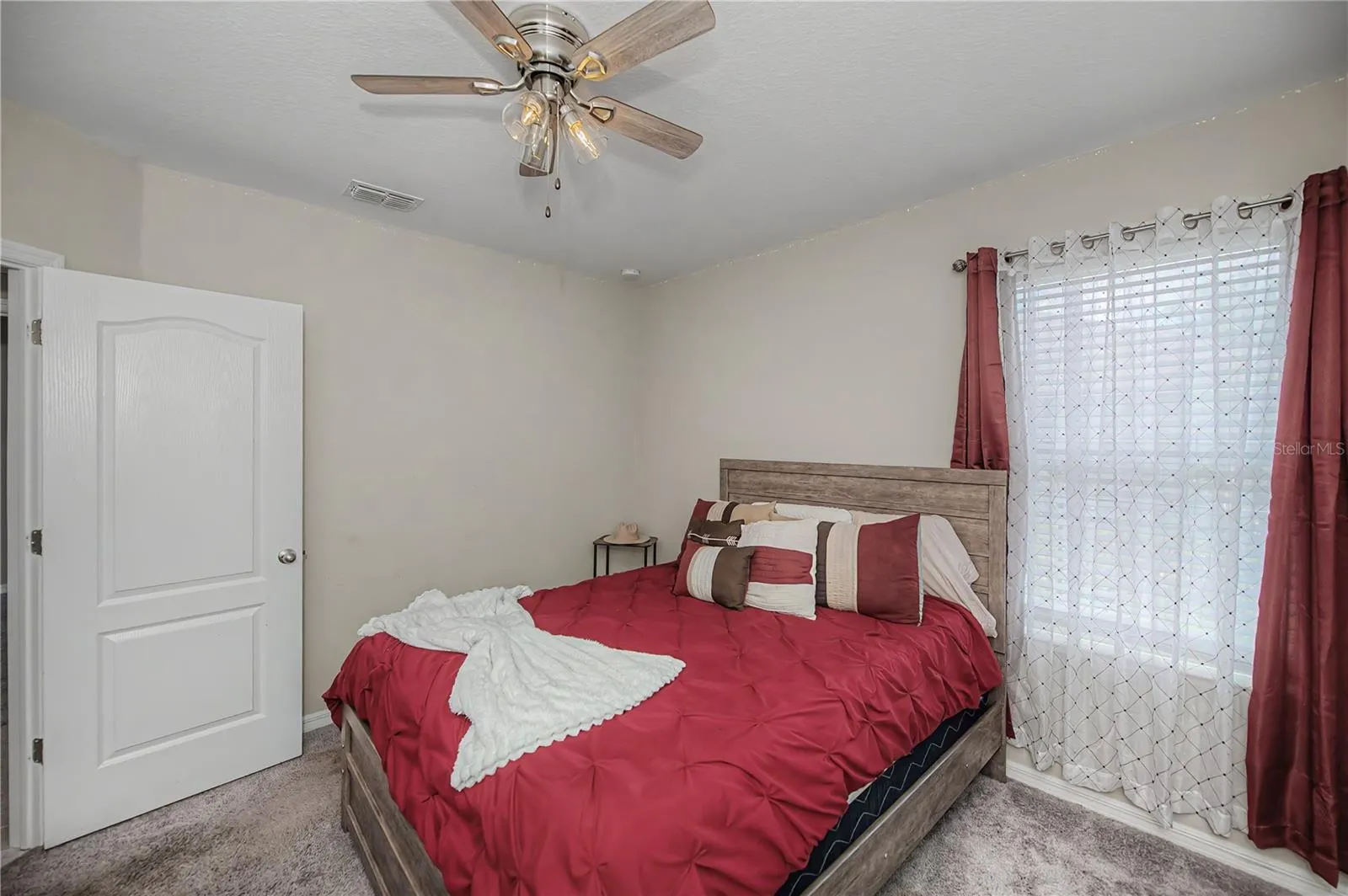 Spacious Second Bedroom with Ample Closet Space.